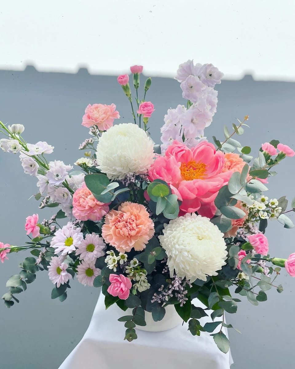 A Vase Filled With Pink And White Flowers Is Sitting On A Table — Clover Country Flowers and Gifts In Pittsworth, QLD
