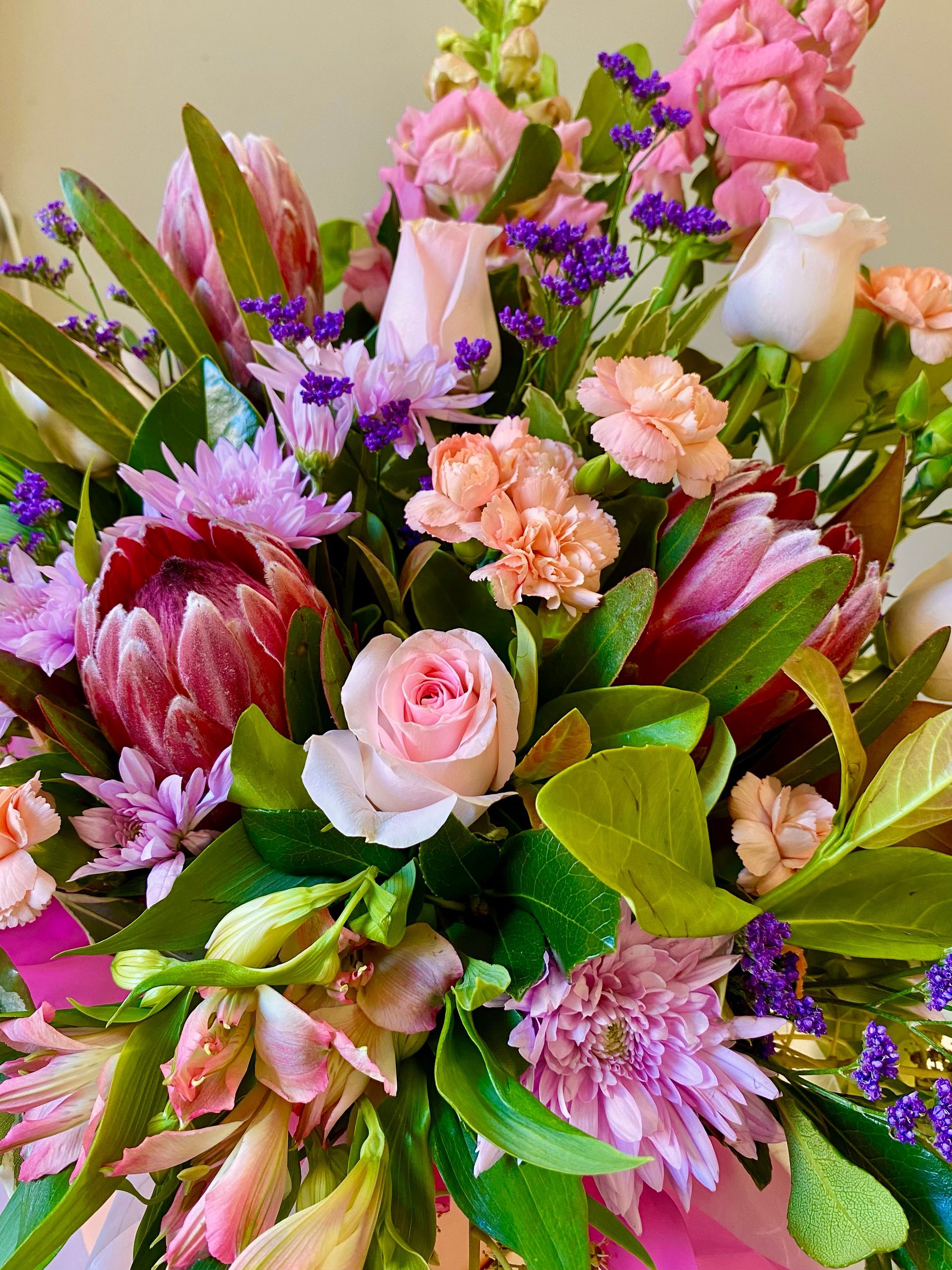 A Close Up Of A Bouquet Of Flowers With Christmas Decorations โ Clover Country Flowers and Gifts In Pittsworth, QLD