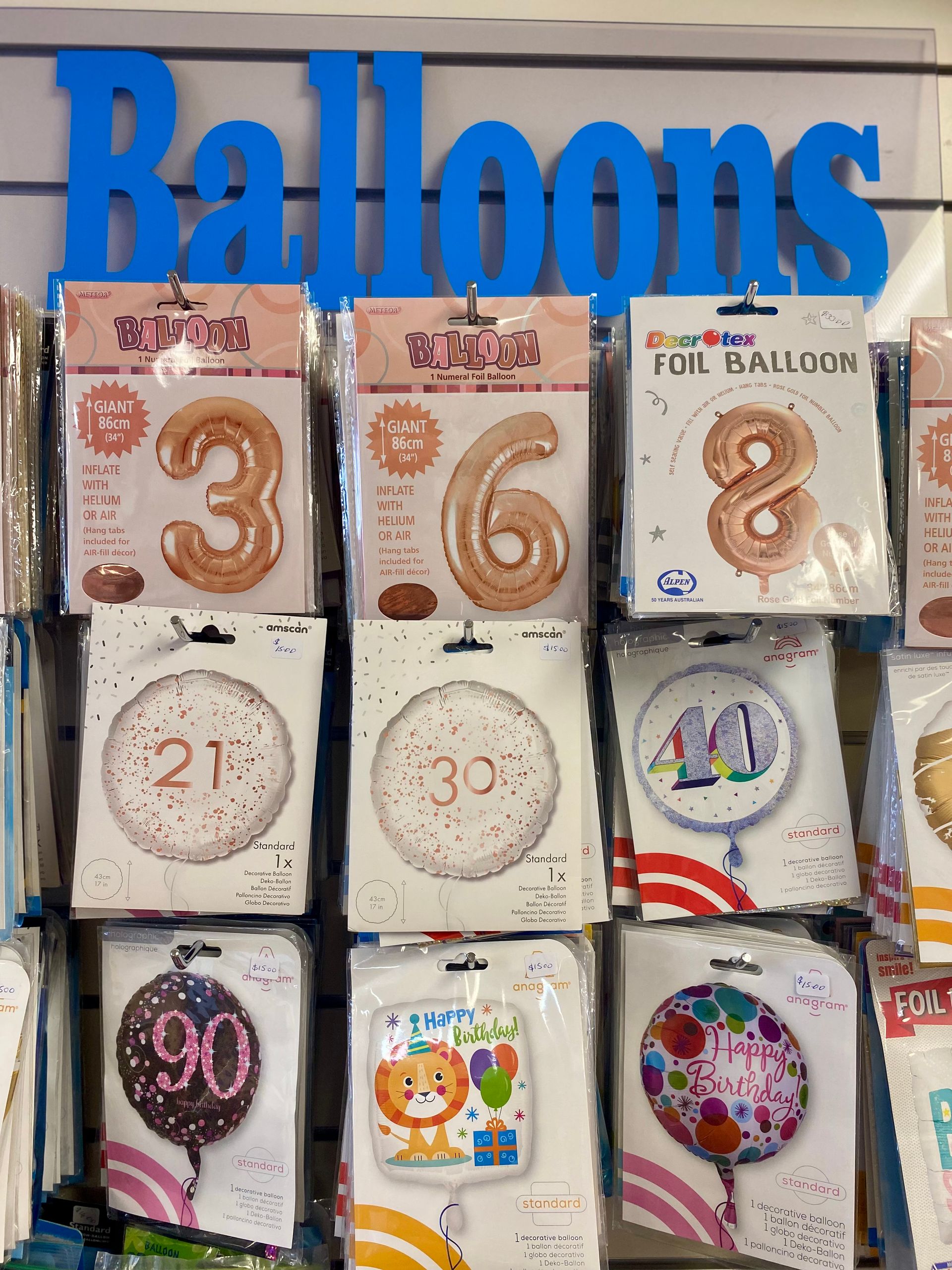 Two Bags With Bows On Them Are Sitting On A Wooden Table — Clover Country Flowers and Gifts In Pittsworth, QLD