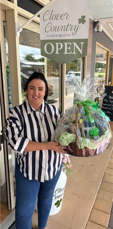 A Bouquet Of Flowers Is Wrapped In Brown Paper — Clover Country Flowers and Gifts In Pittsworth, QLD