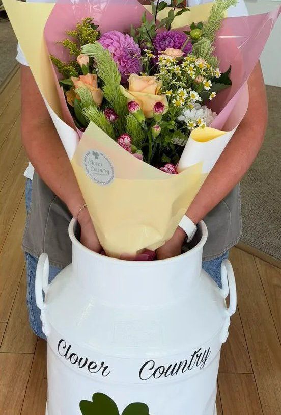 Three Buckets Filled With Flowers Are Sitting On A Wooden Shelf — Clover Country Flowers and Gifts In Pittsworth, QLD
