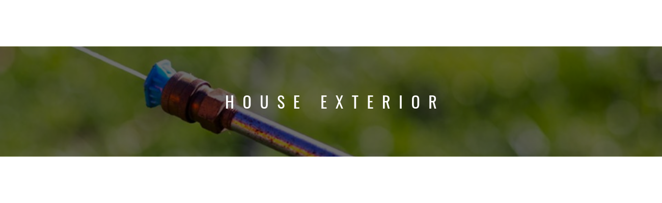 A close-up of a spray nozzle pointed outward against a blurred green background, with the text 