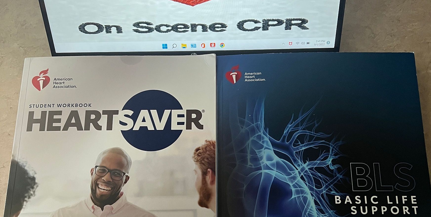 A box of heartsaver basic life support sits next to a box of on scene cpr