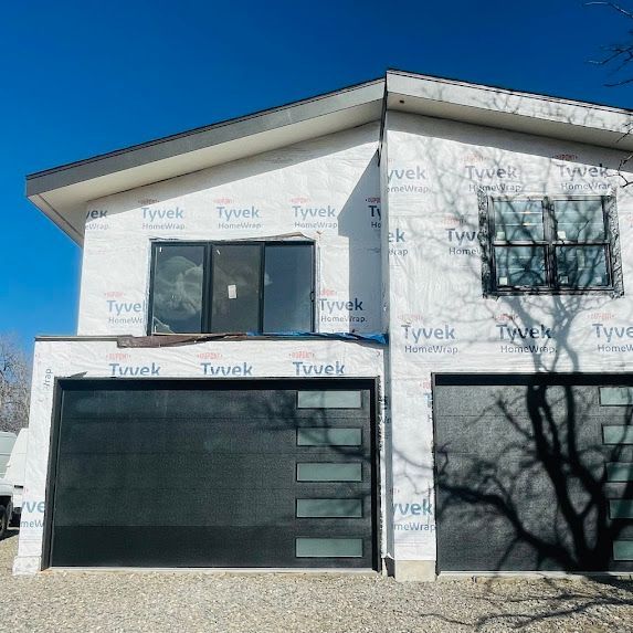 A house is being built with styrofoam on the side of it