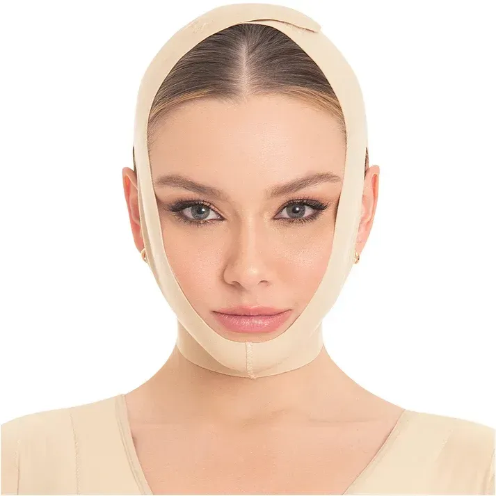 A woman wearing a bandage around her face looks at the camera