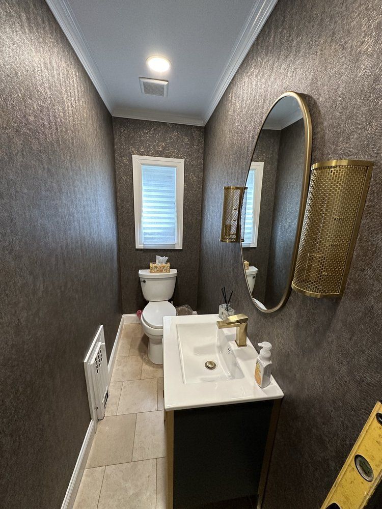 A ladder is sitting in front of a house under construction.