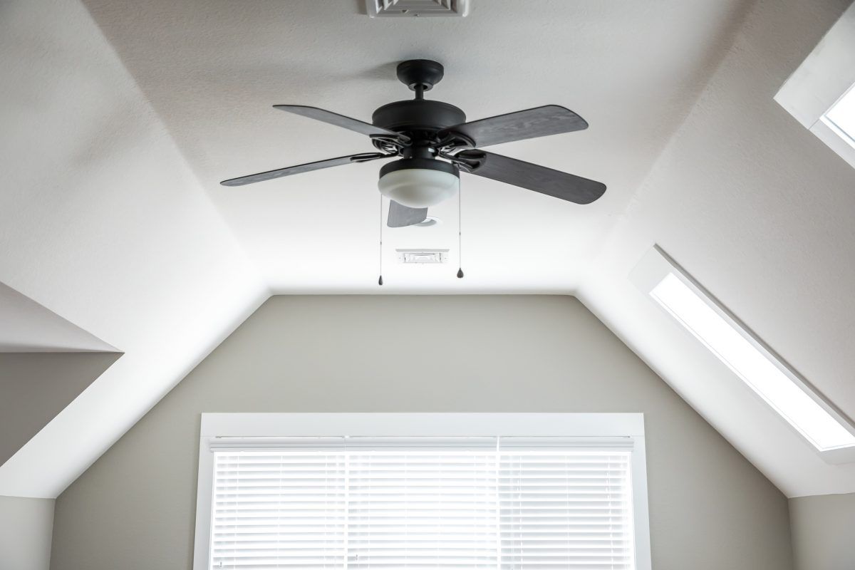 A ceiling fan in an upstairs room.