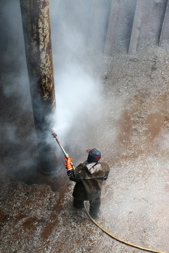 Pressure Washer Cleaning in Front of the House — Ultra-High Pressure Water Blasting in the Northern Territory
