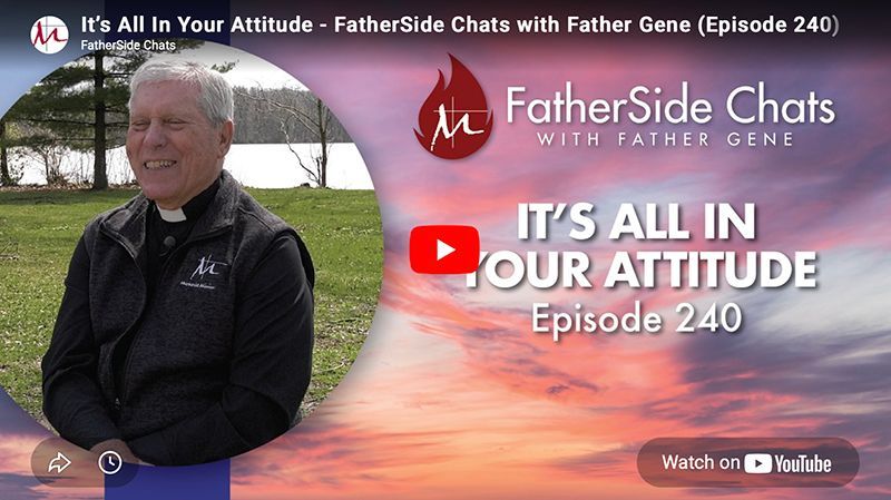 Father Gene sits outdoors, with