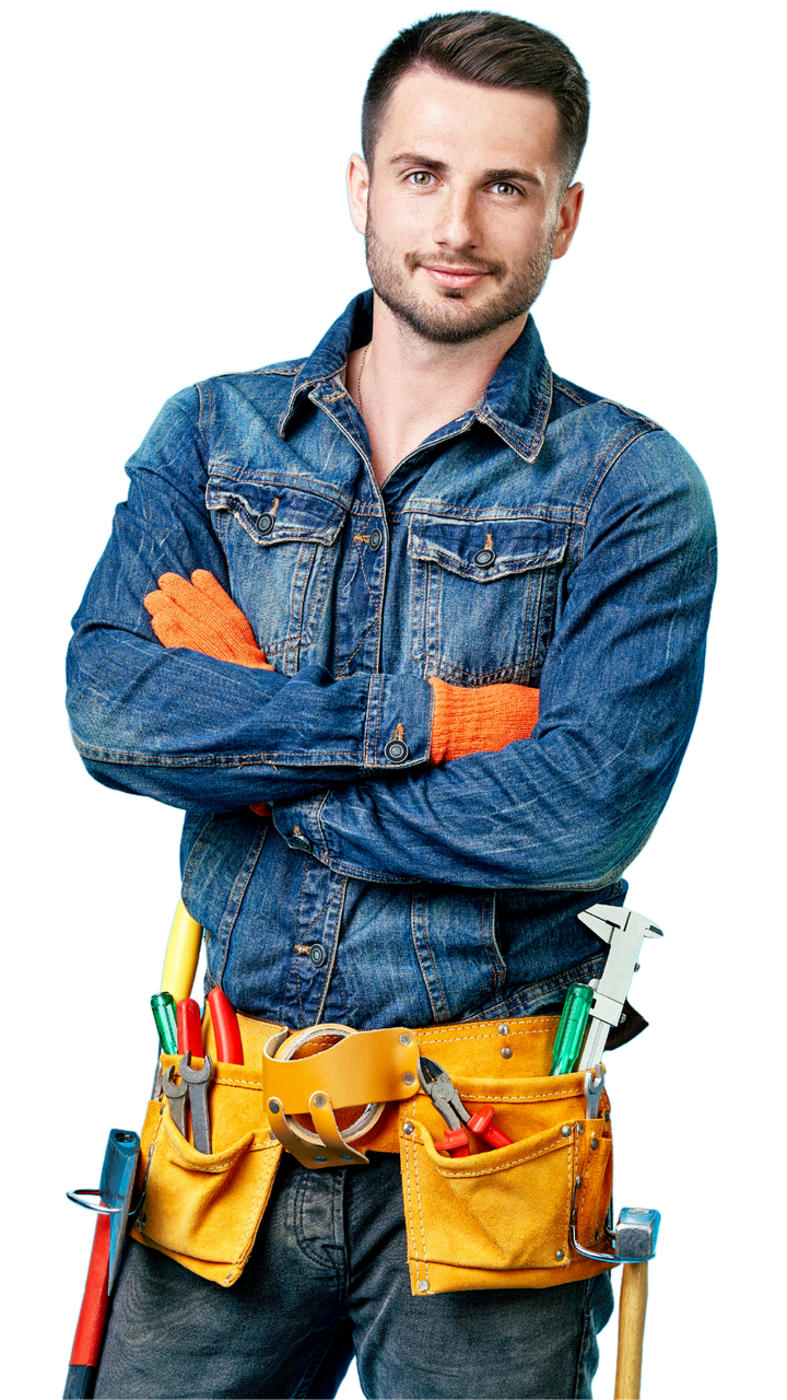 A man in a denim shirt and tool belt is standing with his arms crossed.