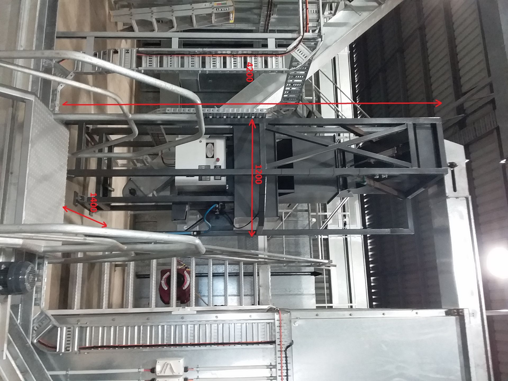 Metal industrial structure with ladders and platforms; possibly a factory setting.