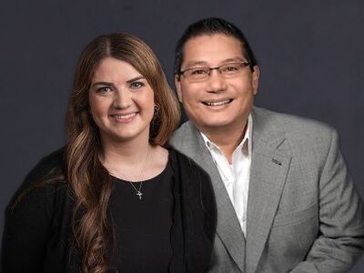 A man and a woman are posing for a picture together.