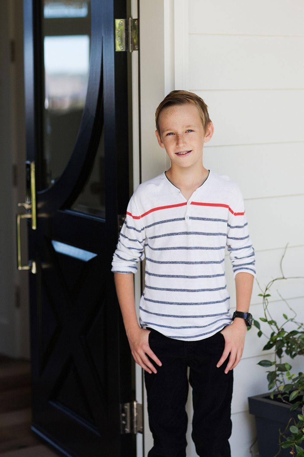 Portrait of son in front of the house in San Juan Capistrano