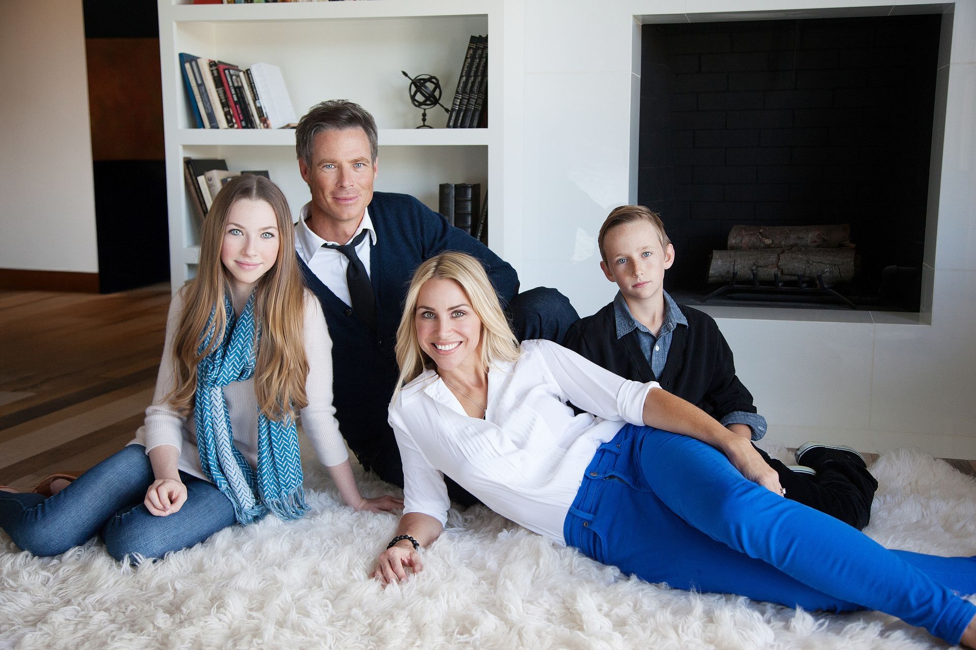 In-home lifestyle family portrait in San Juan Capistrano living room with natural light.