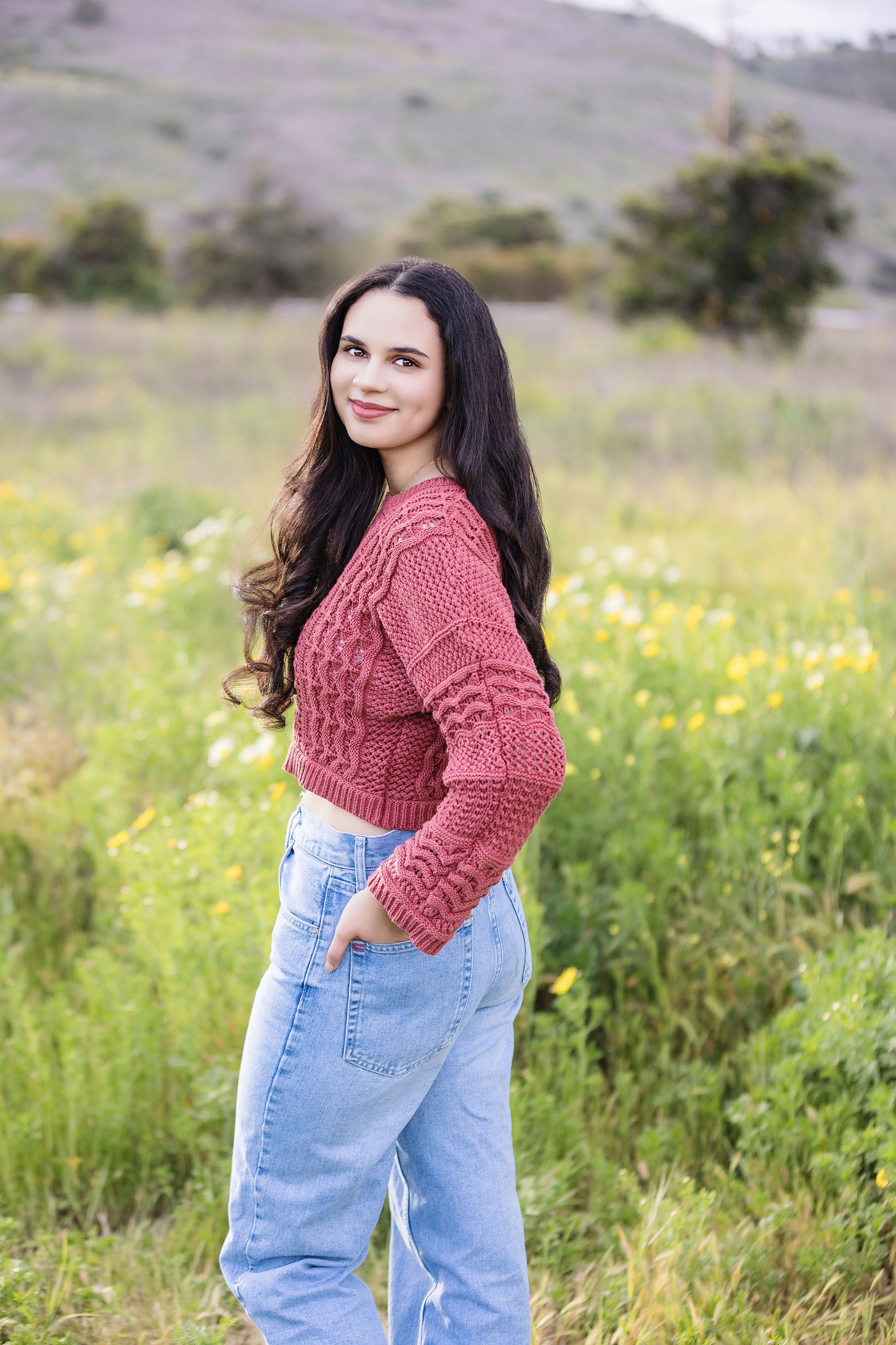Stylish Orange County senior portrait in a rustic field, perfect for graduation announcements and keepsakes