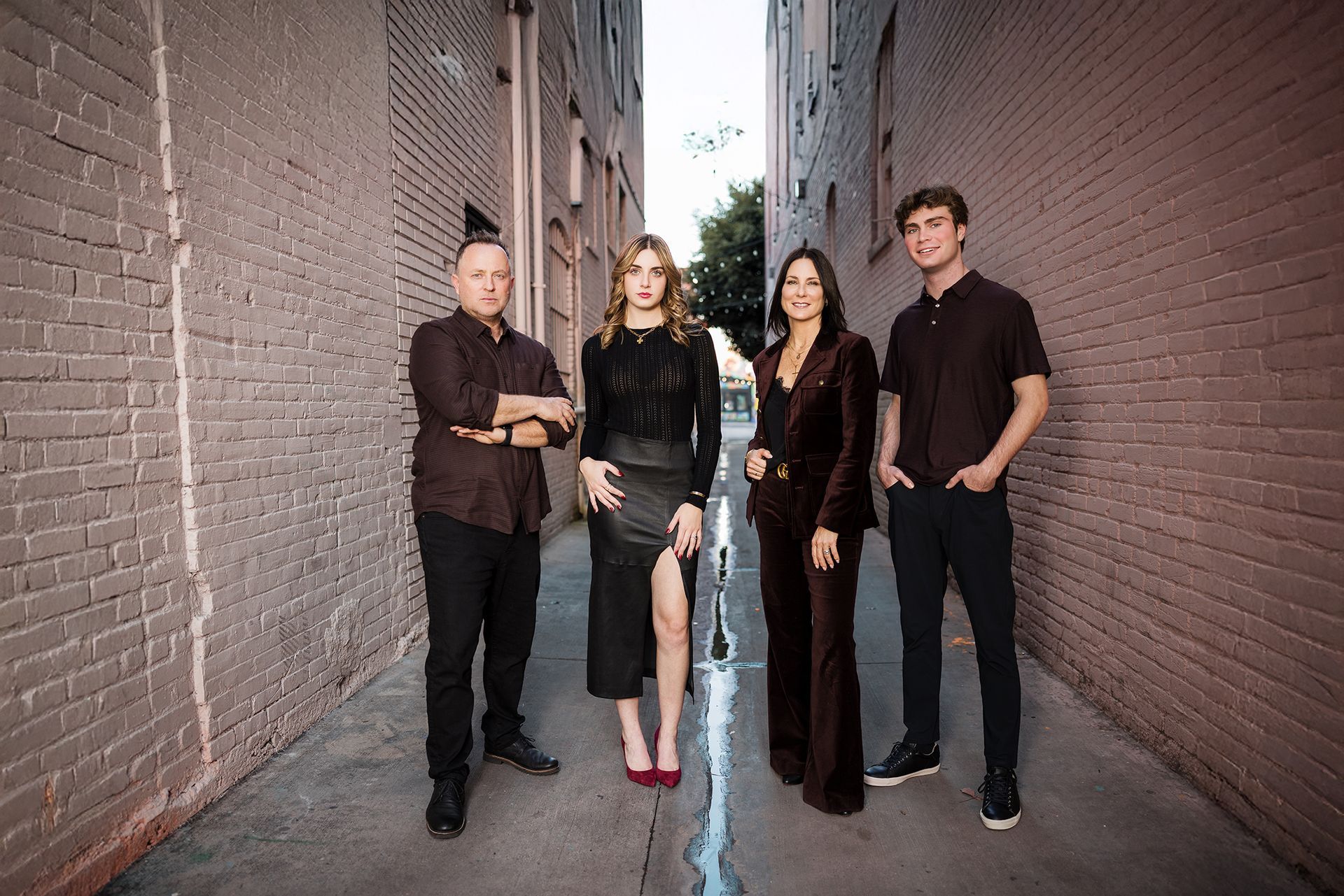 Candid urban family photography in Downtown Santa Ana alleyway.