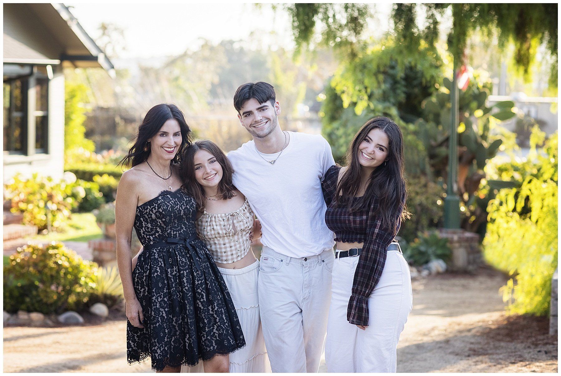 Lifestyle family portraits in Old town San Juan Capistrano.  Wearing neutral colors and black
