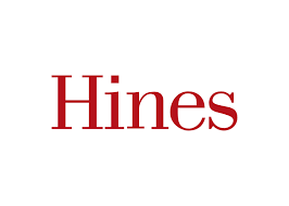 A red and white logo for hines on a white background.