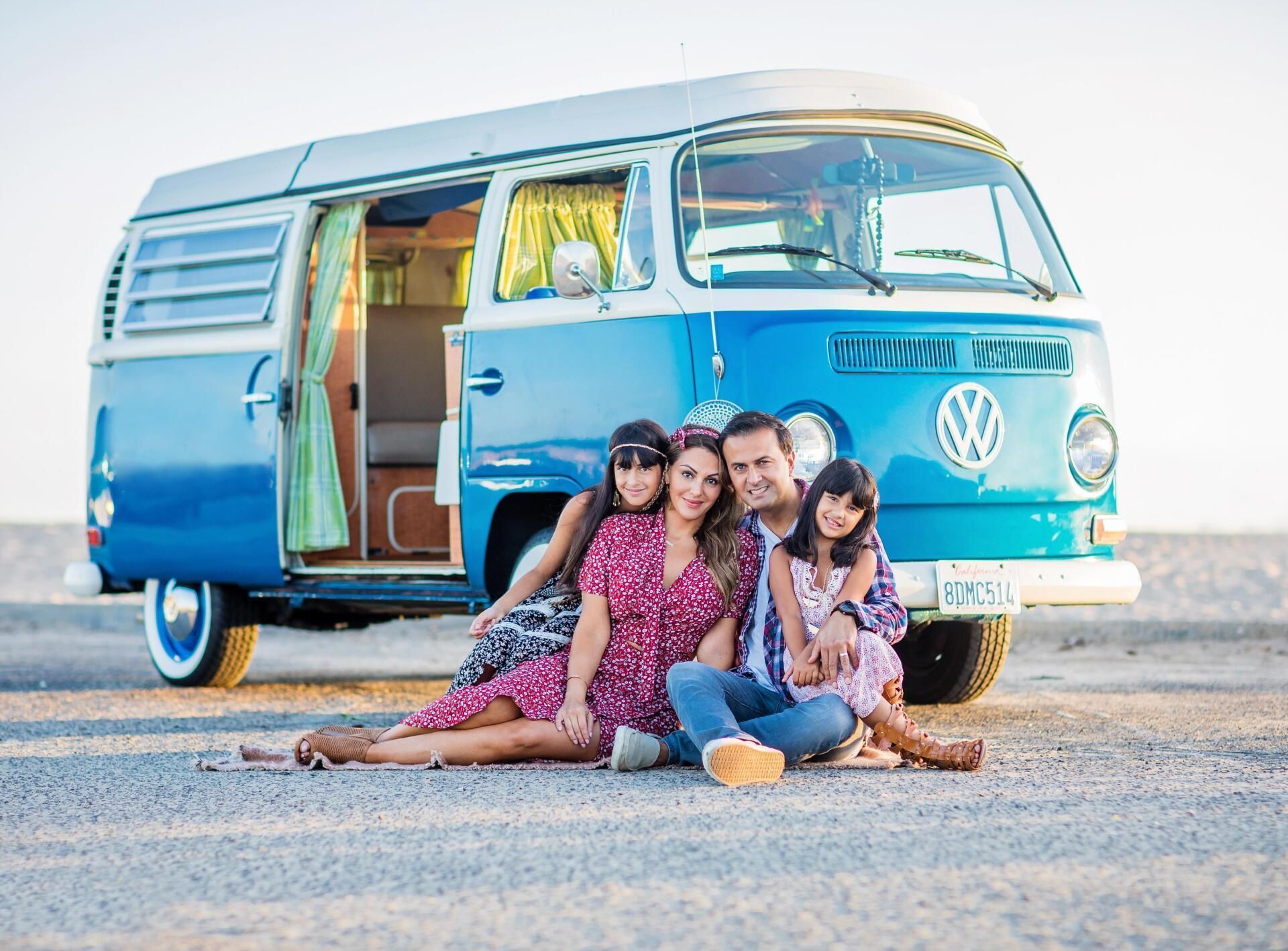Orange County family photographer — a family at golden hour with a vintage van in Huntington Beach