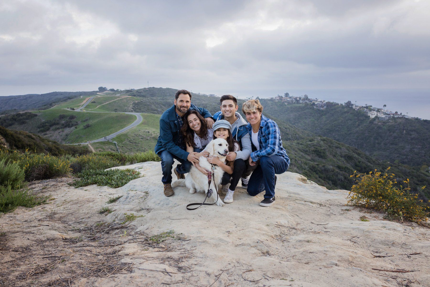Family portraits in Laguna Beach at Top of the World with the family dog.