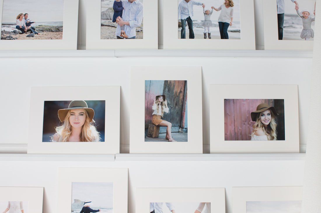 A wall with a bunch of pictures on it.