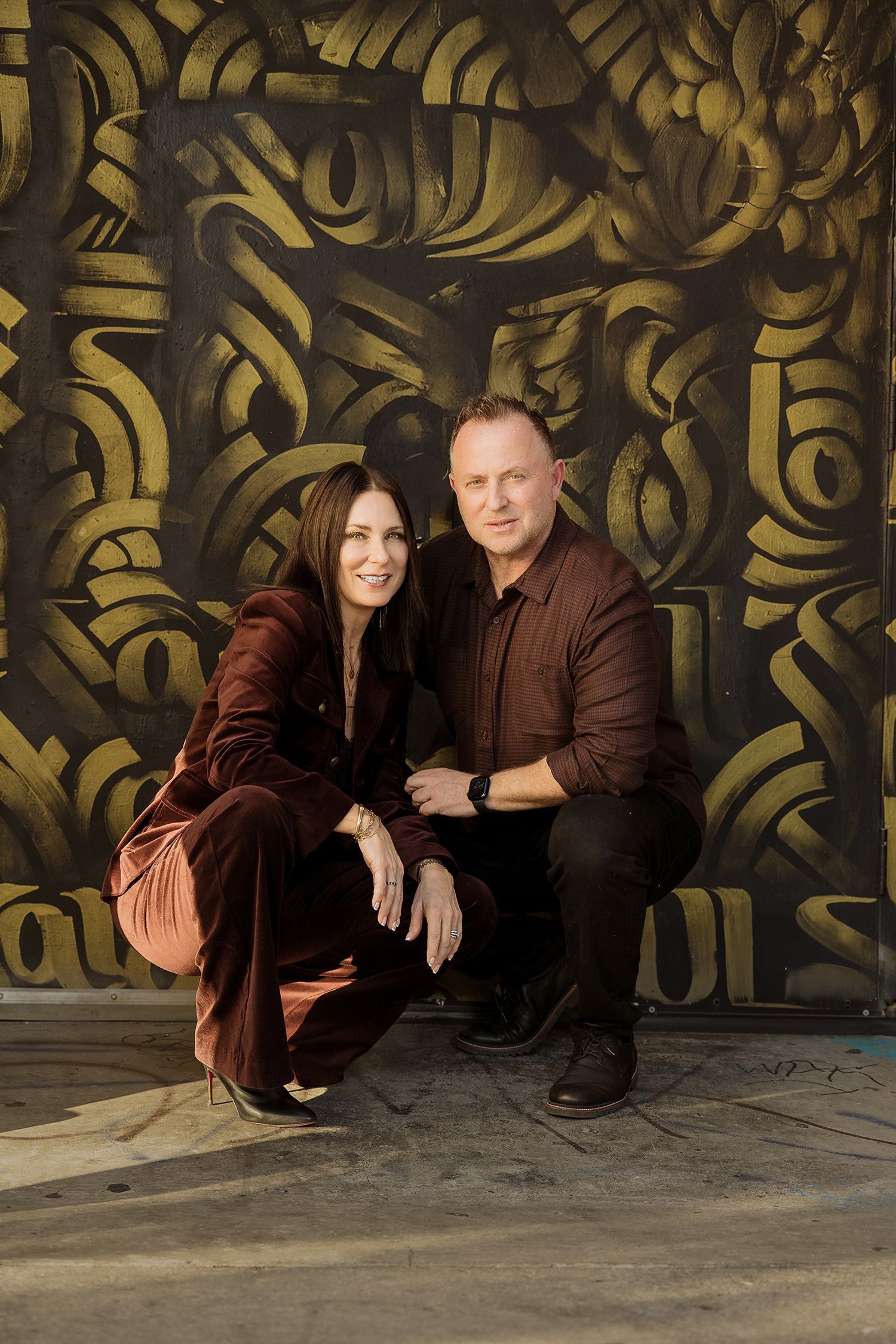 Edge family portraits in gold doorway in Santa Ana Art District