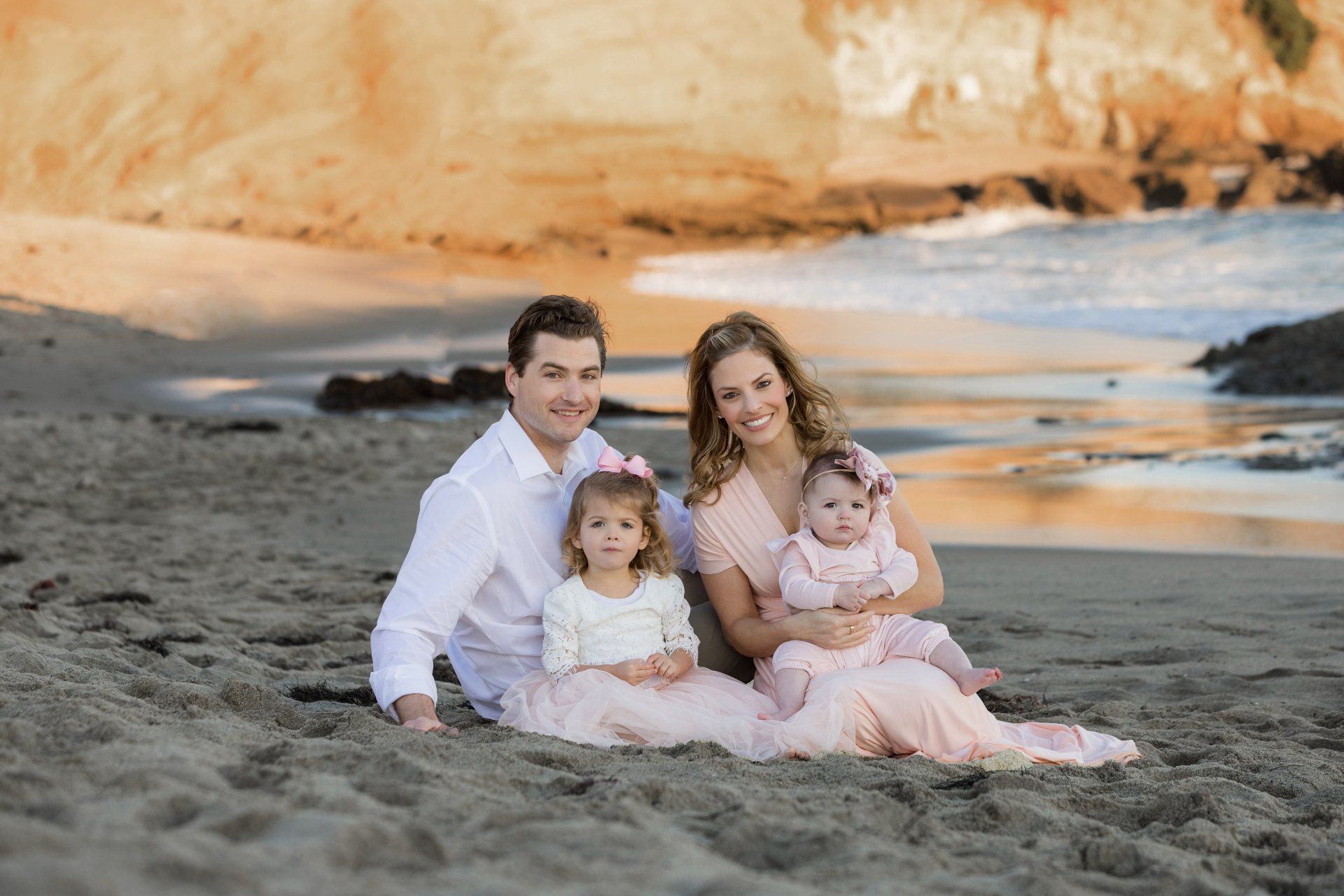 A family photography session on the beach in front of the Montage Beach Resort with toddler age kids