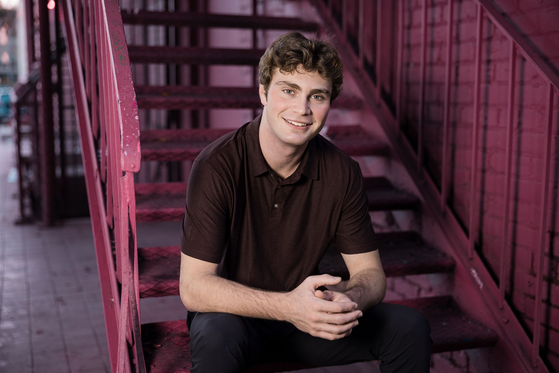 eenage boy posing for urban portraits in Downtown Santa Ana Artists Village.