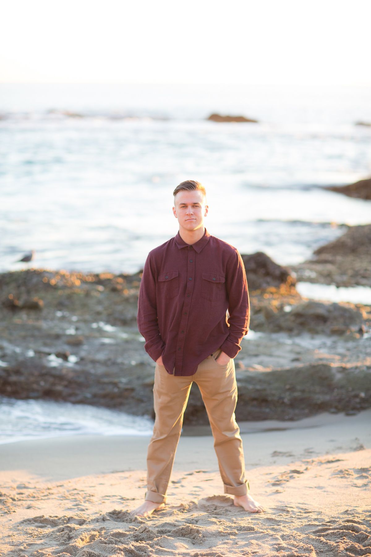 Hight School Senior guy at sunset photographed at Victoria Beach