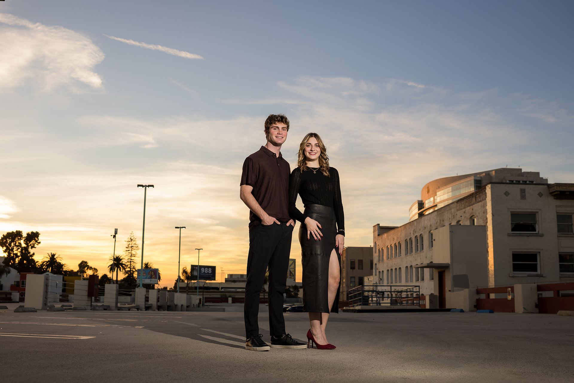 Siblings laughing together during a Santa Ana Art District family photo session at Golden hour