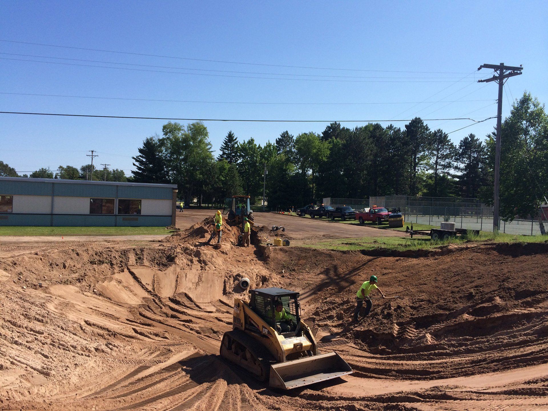 A bulldozer is moving dirt on a construction site