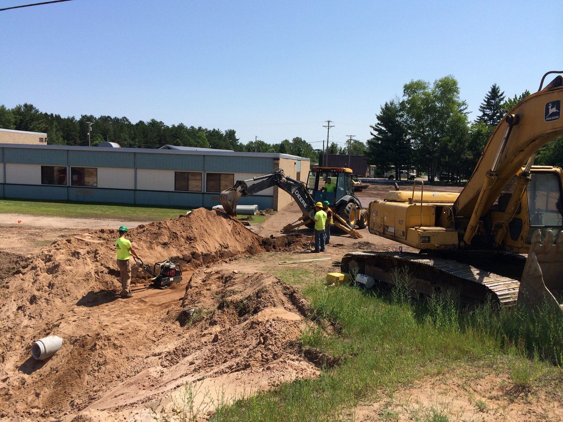 A group of construction workers are working on a construction site.
