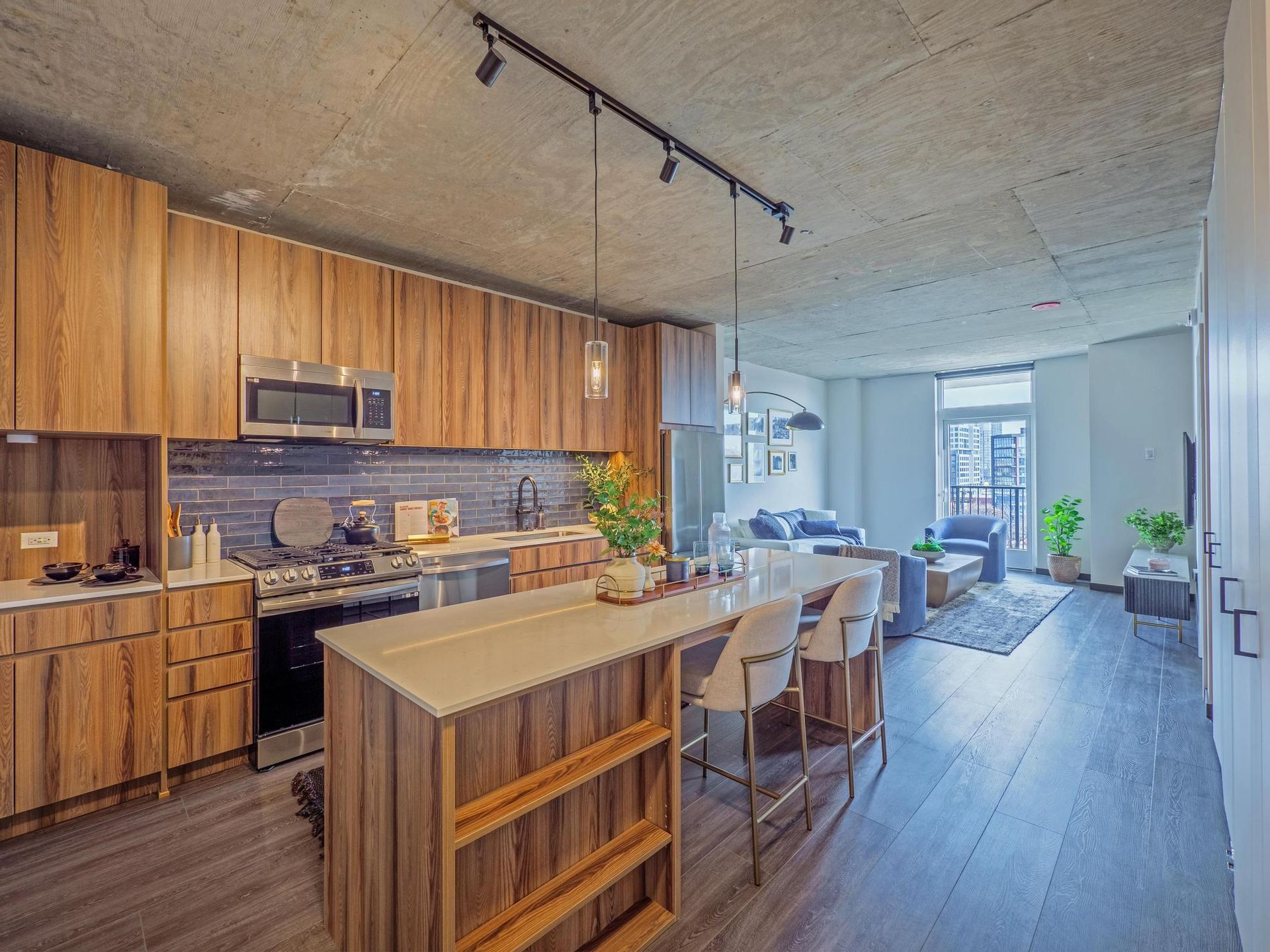 modern open-concept apartment with a luxury kitchen at The Thompson at Fulton Market