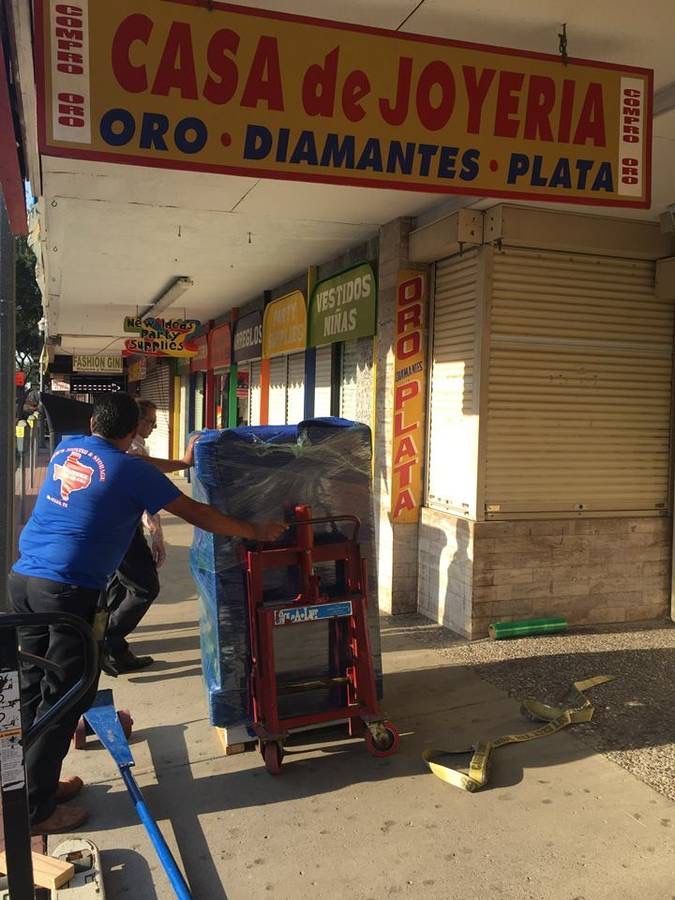 Mover moving items on dolly