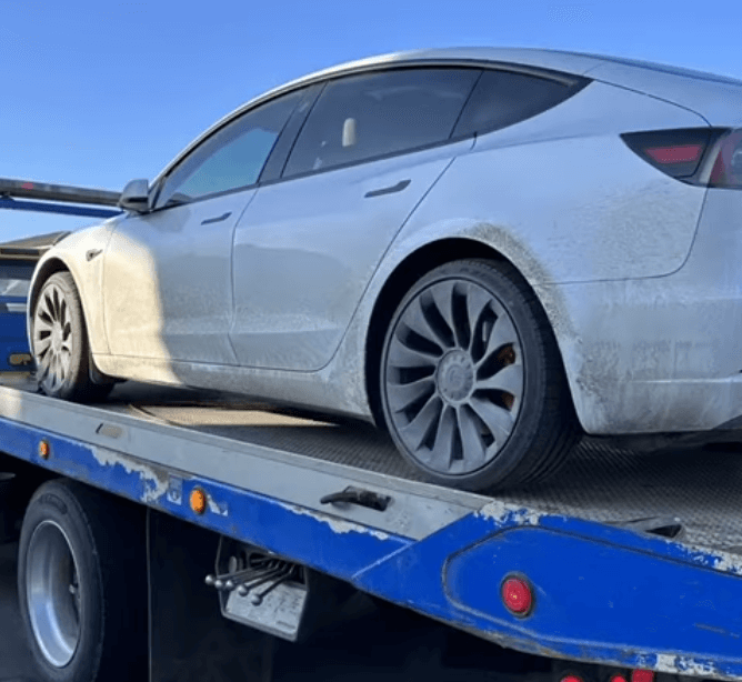 Towing a car with a flat tire in harper woods, MI