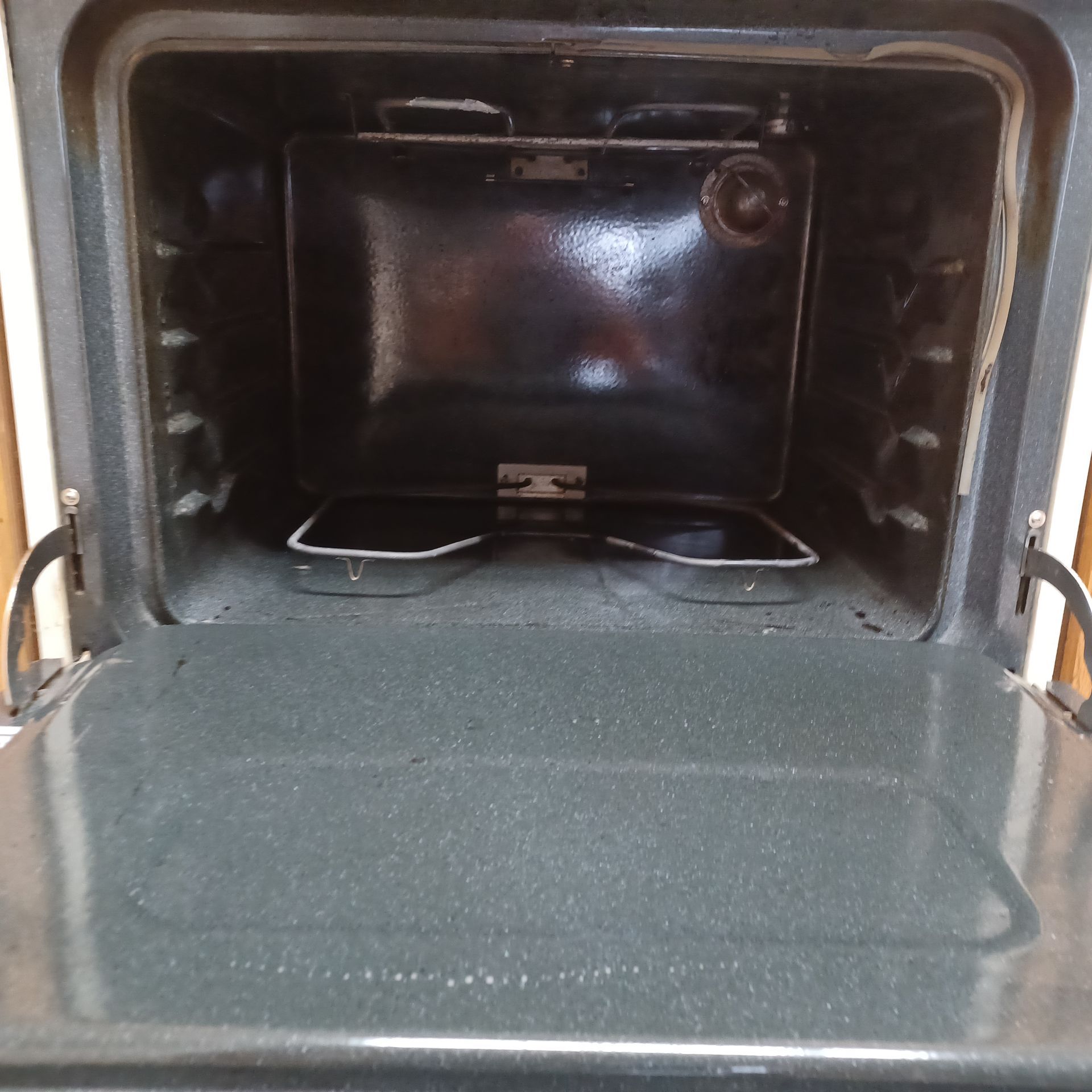 The inside of an oven with the door open
