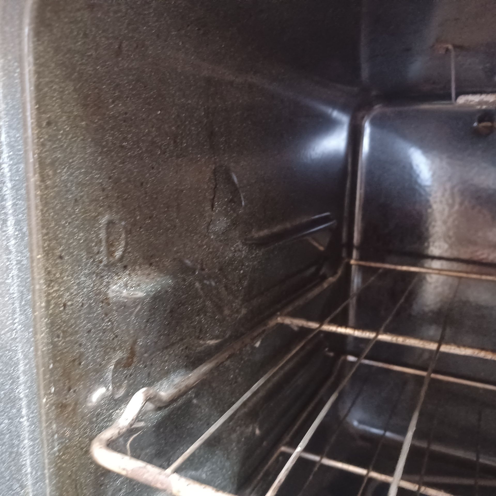 The inside of a oven with a wire rack — Springdale, AR — Lady Bug Cleaning Services