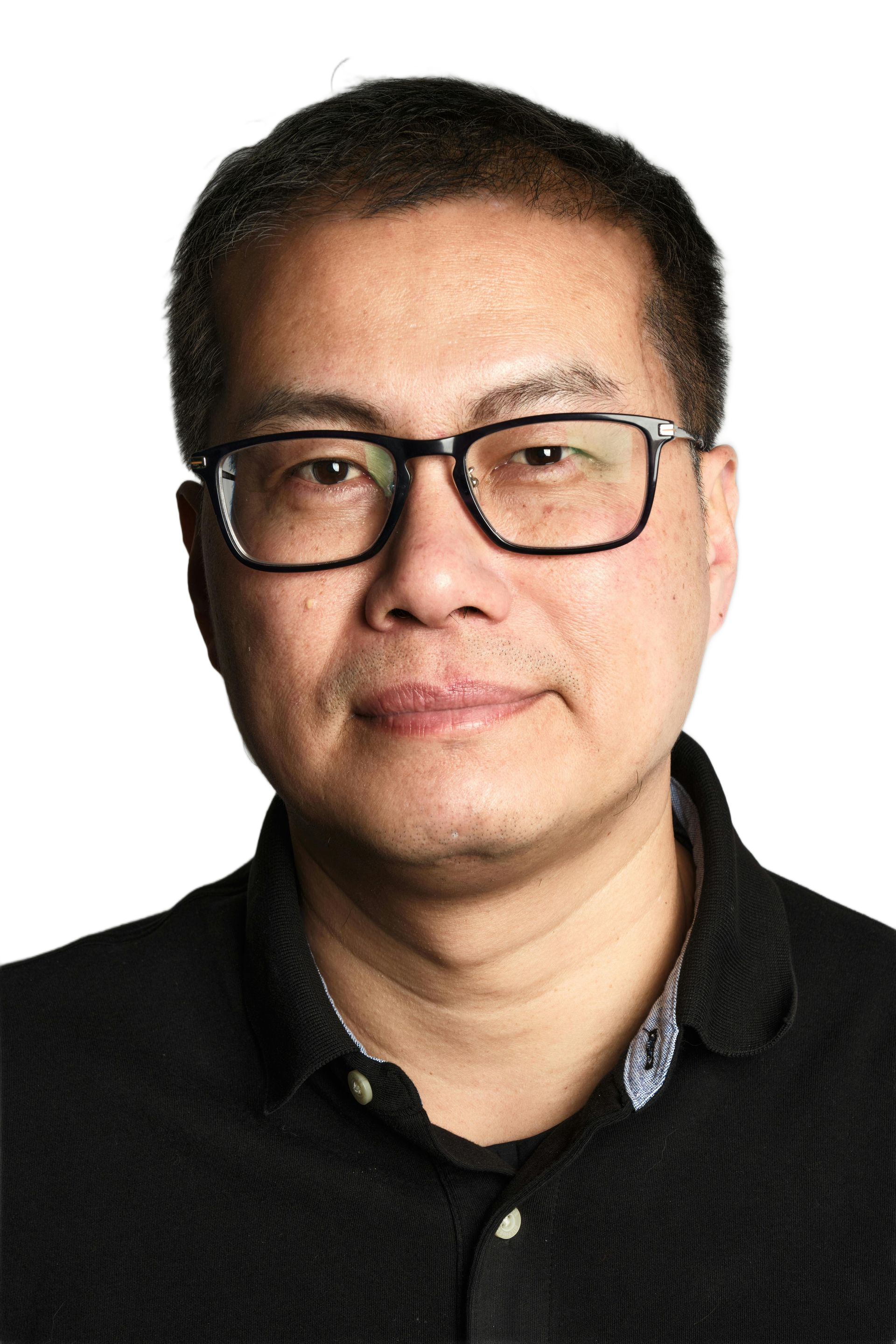 Man with glasses and dark shirt, looking at the camera.