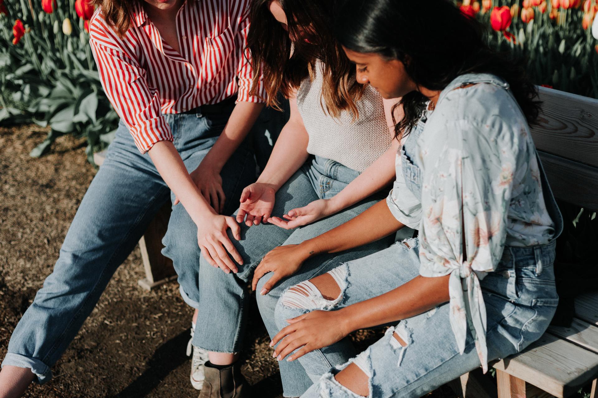 Friends praying together