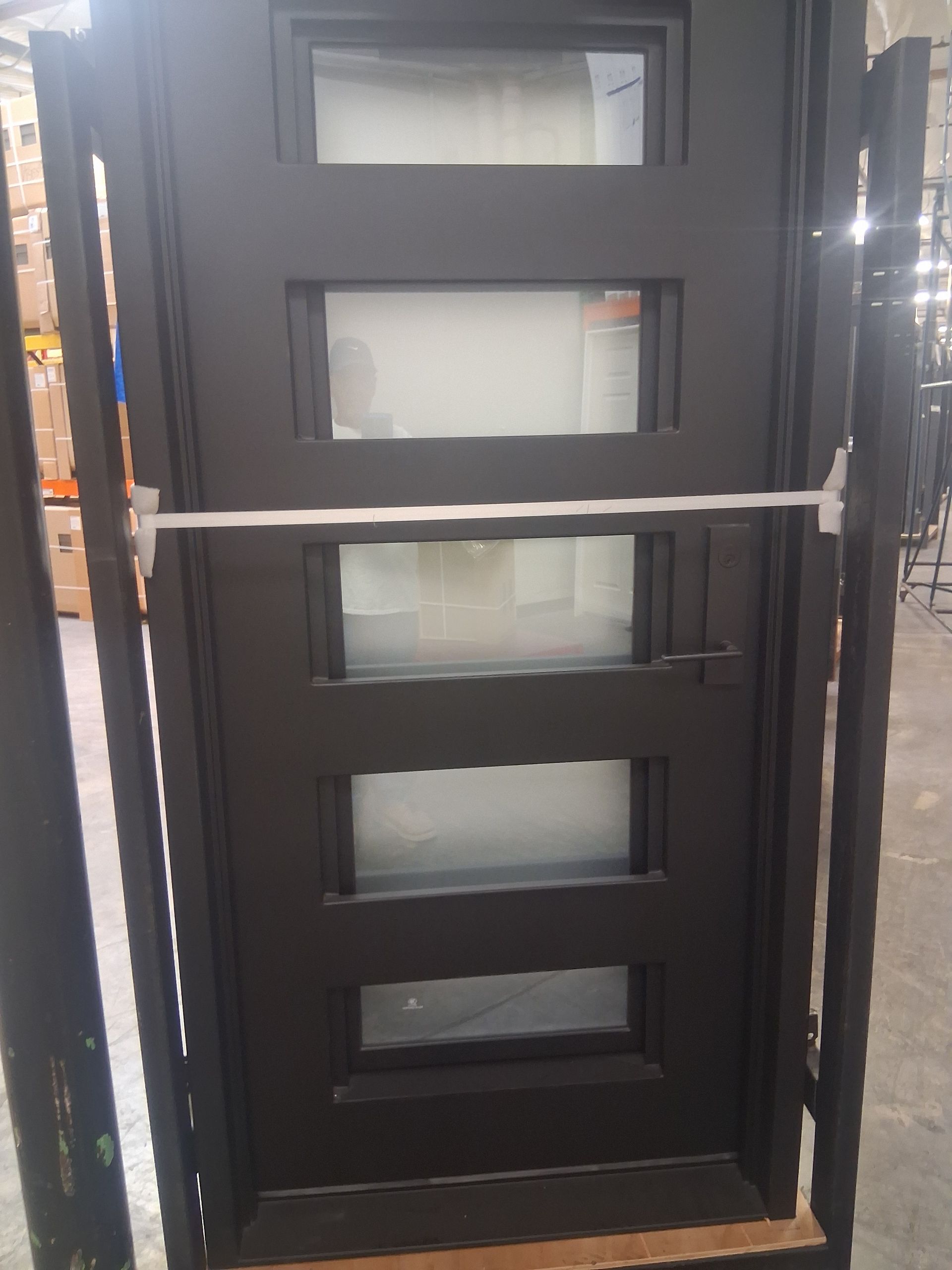 Gilbert home receiving modern black-framed patio door
