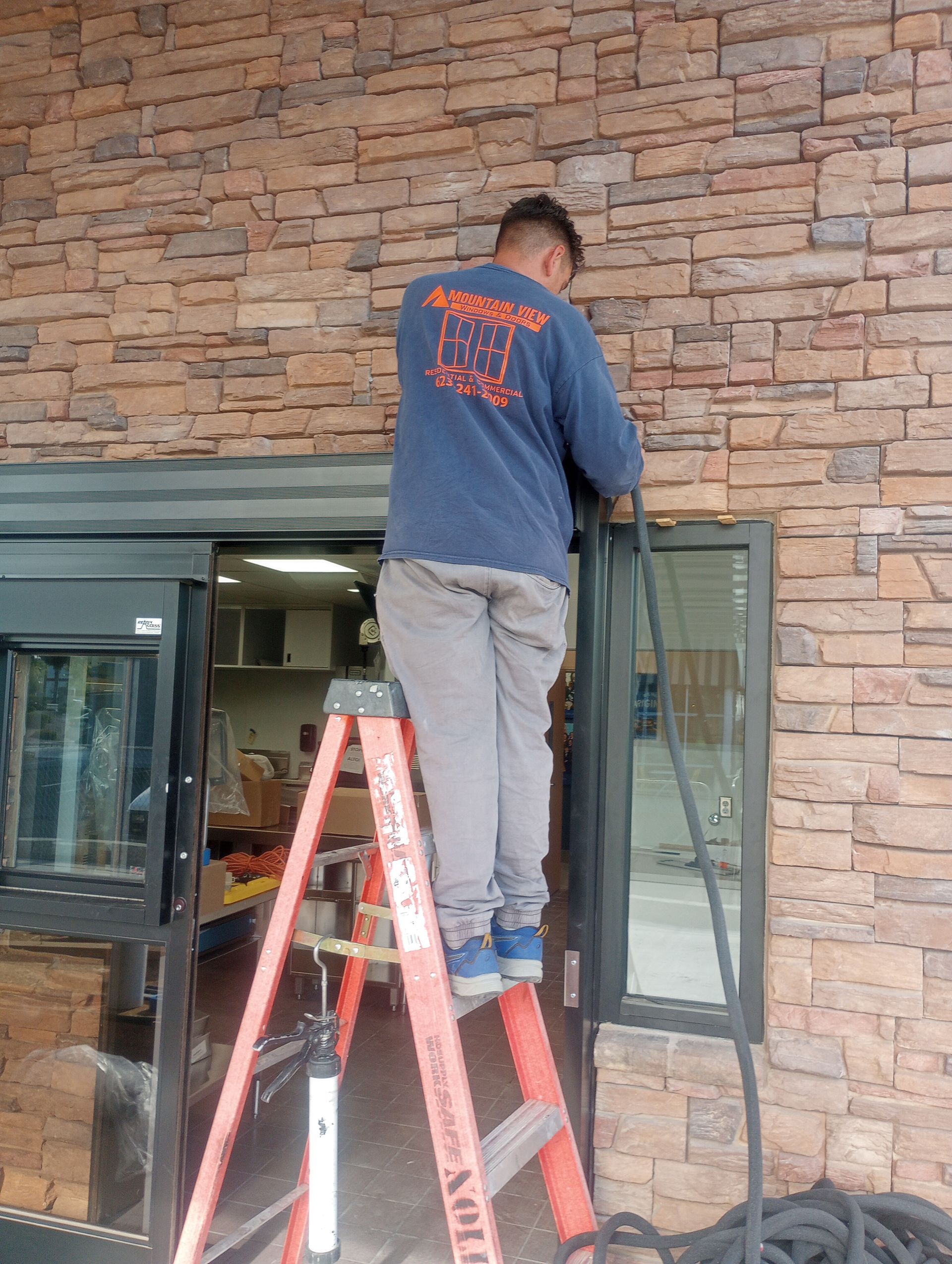 Mesa contractor measuring frame for window replacement