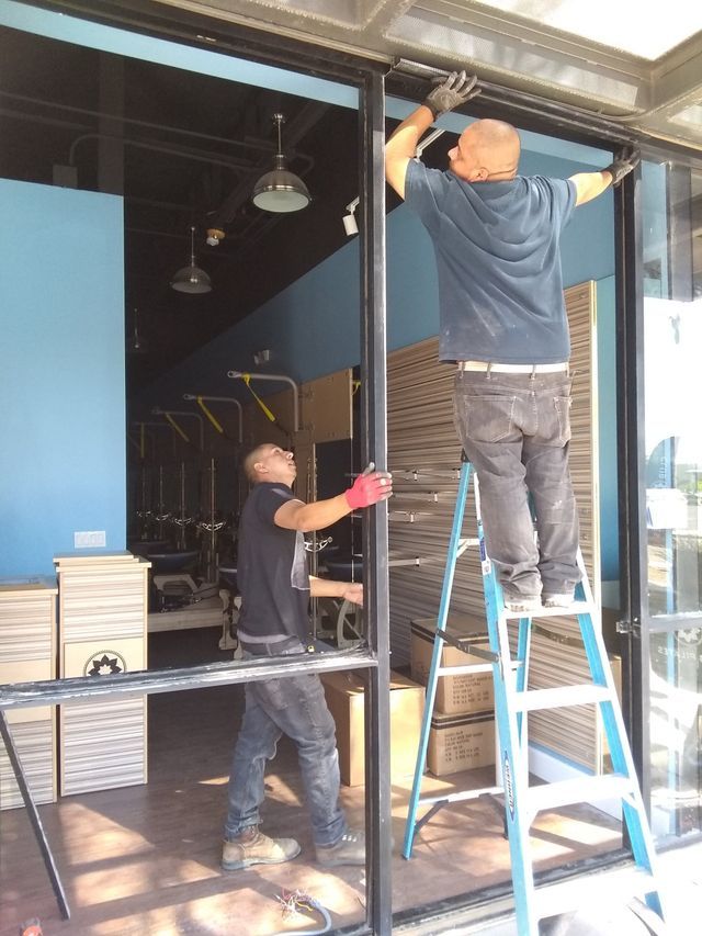 Phoenix contractor fitting commercial-grade aluminum window frames