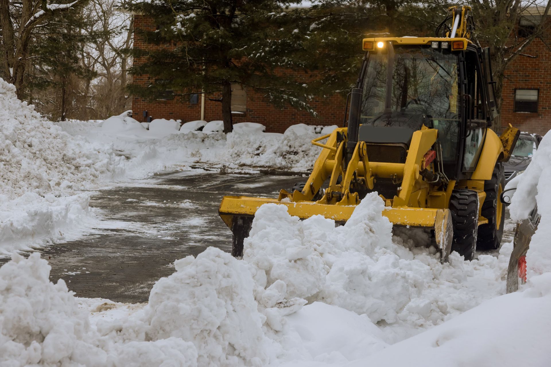 Snow clearing tractor after heavy snowfall for EDM Home Services