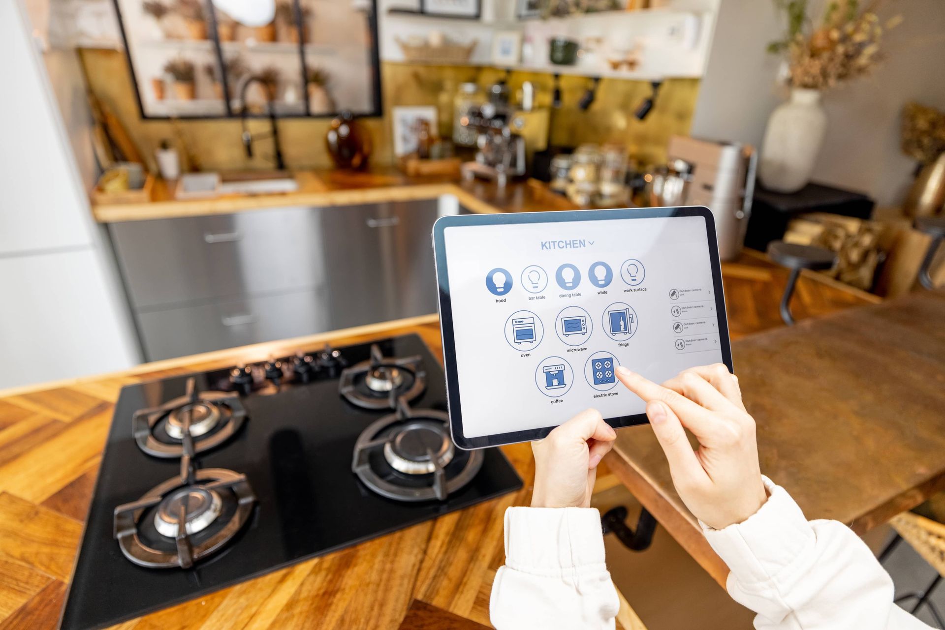 Woman holding digital tablet with running smart home system for EDM Home Services