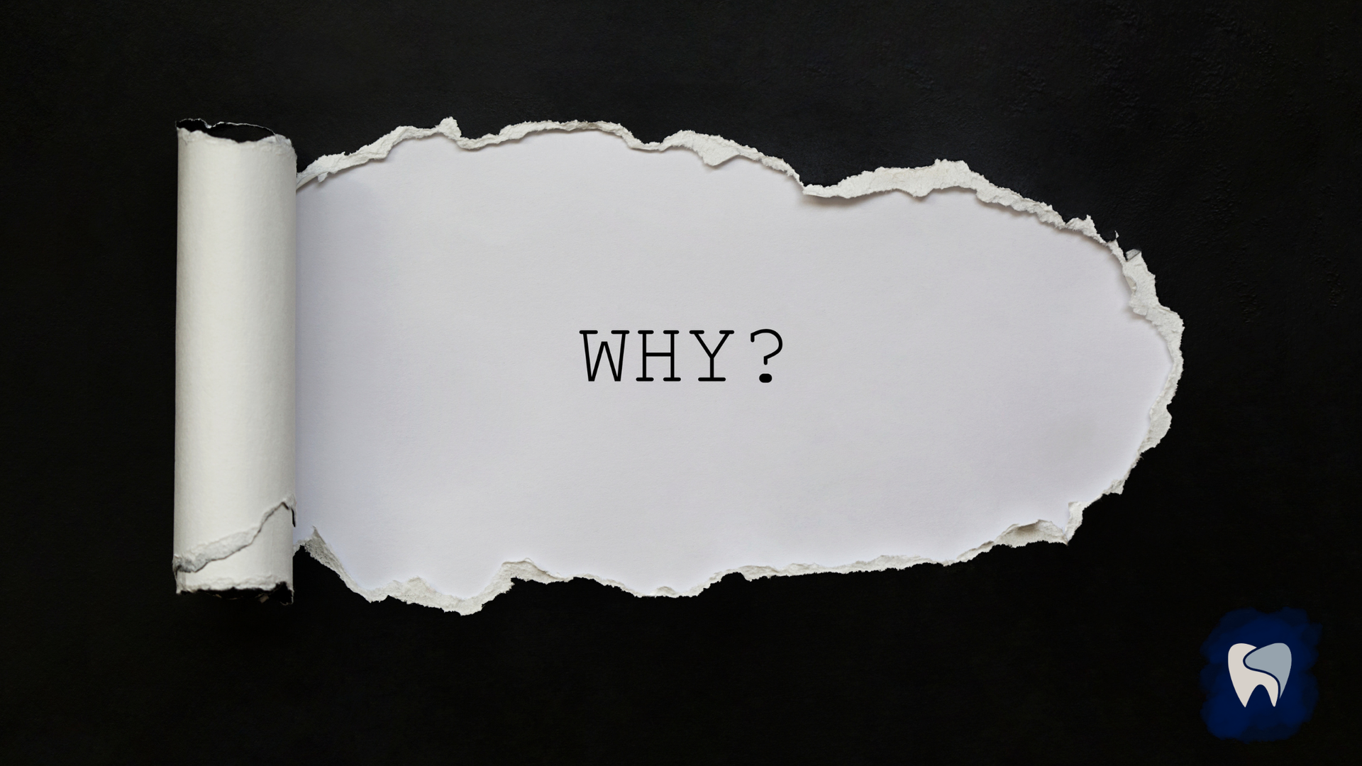 Torn black paper reveals 