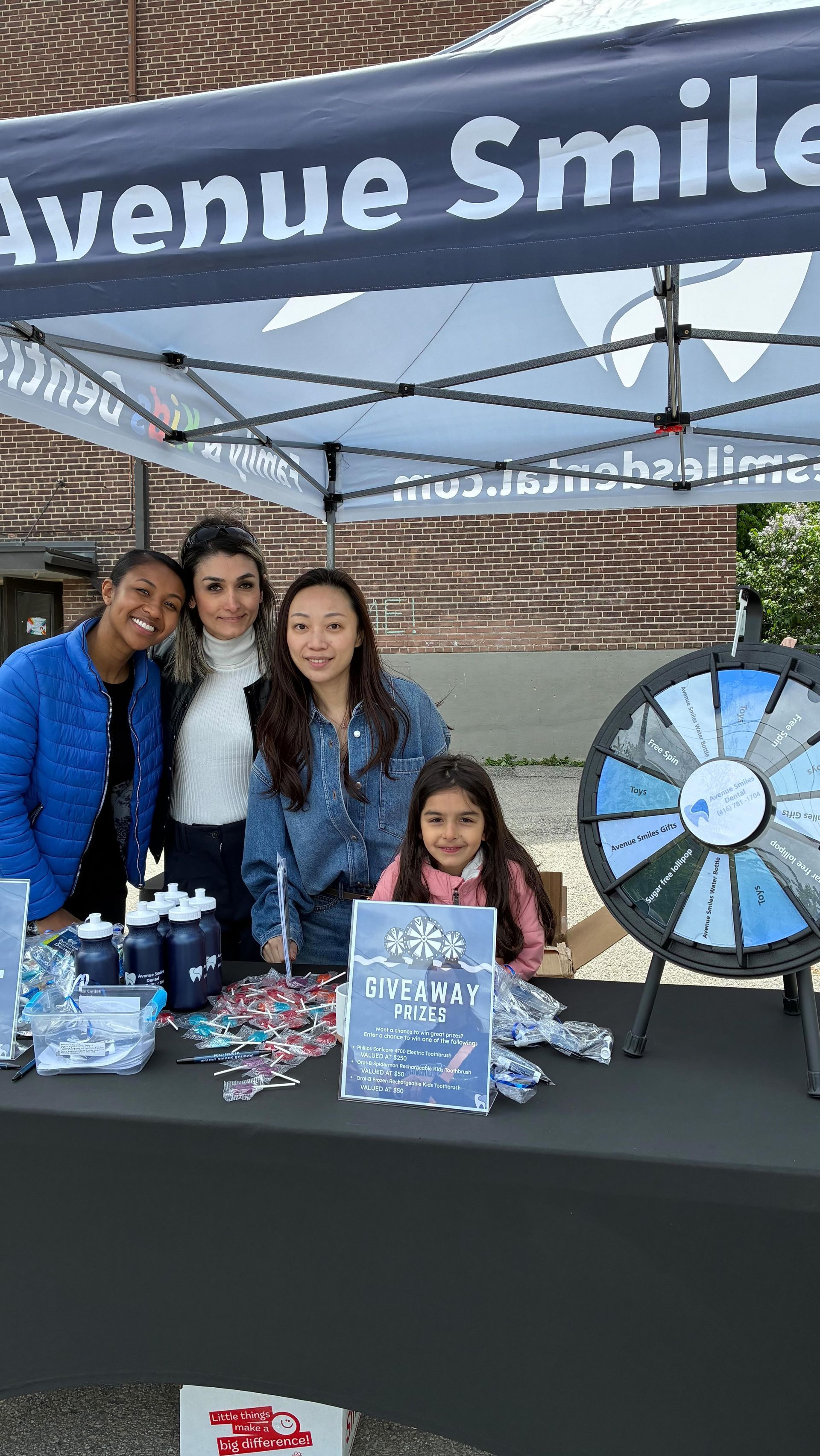 Four people at a booth for 
