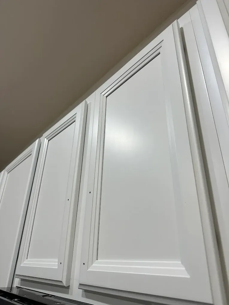 White kitchen cabinets, viewed from below.
