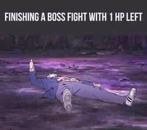 A person lies exhausted on the ground, raising a bottle, celebrating after a difficult boss fight.