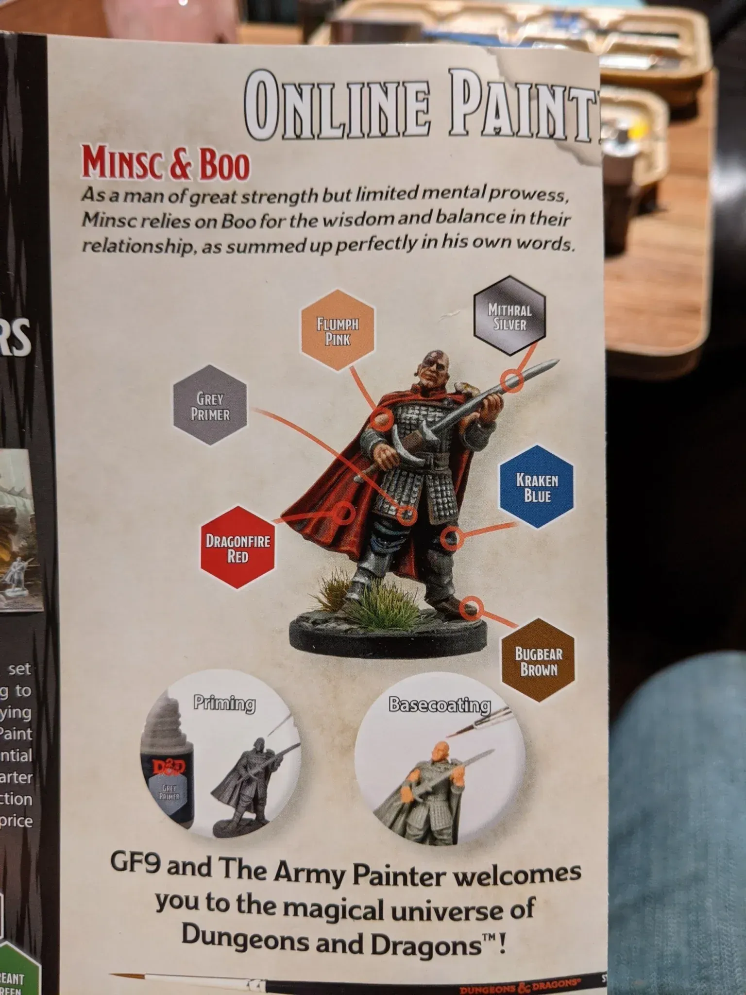 Advertisement for painting miniatures: a figure with color-coded paint instructions.