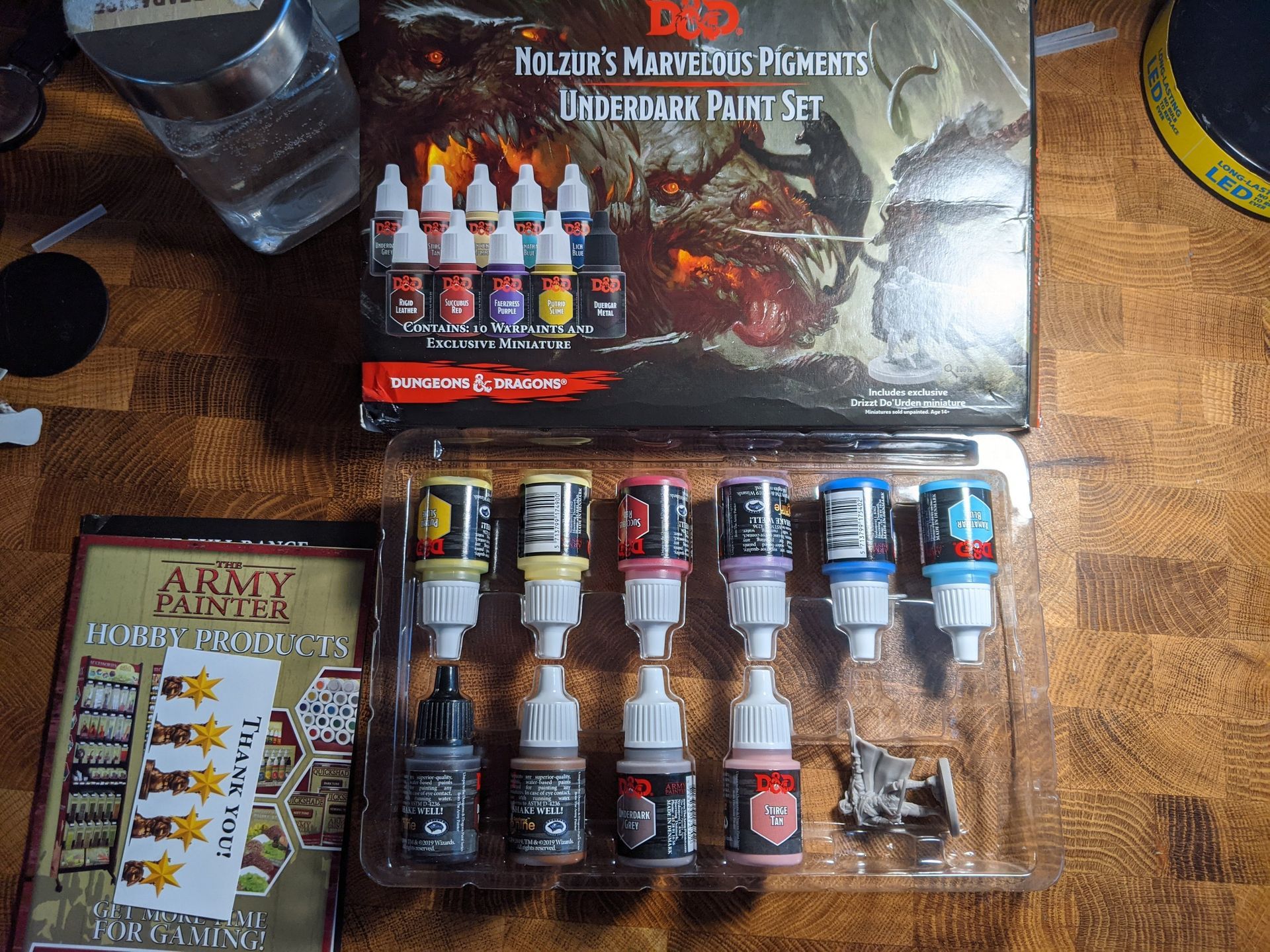 DnD Underdark paint set with paints, a model, and instructions.